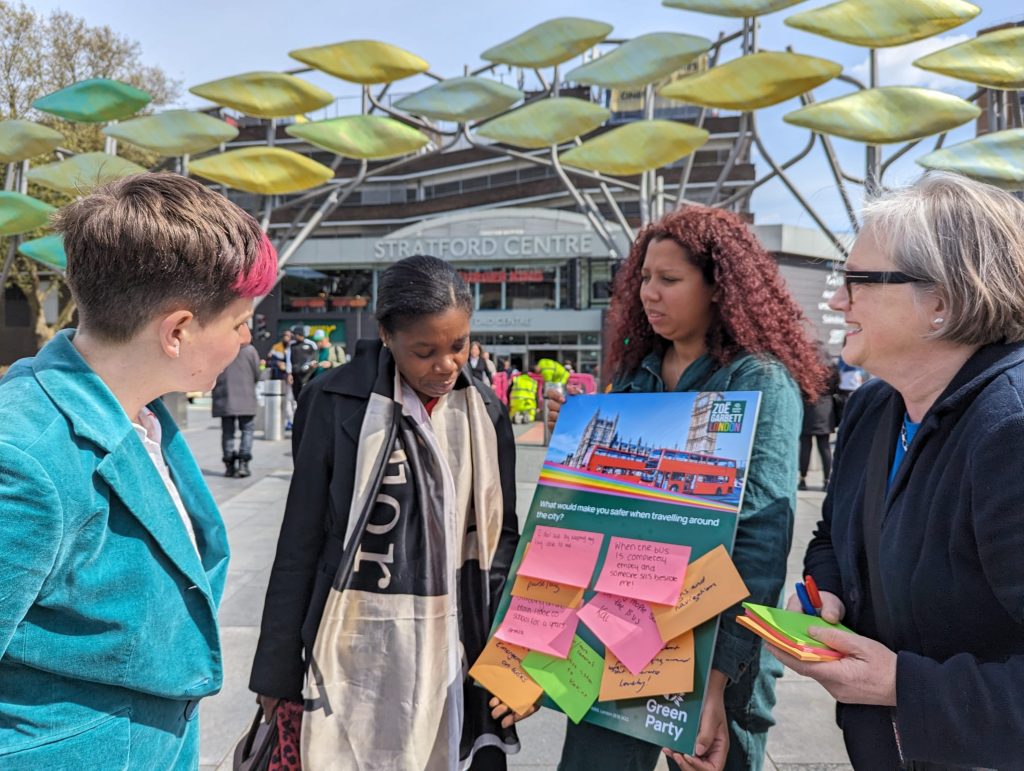 Zoe Garbett, Caroline Russell and Marz King talking to a member of the public outside Stratford Station