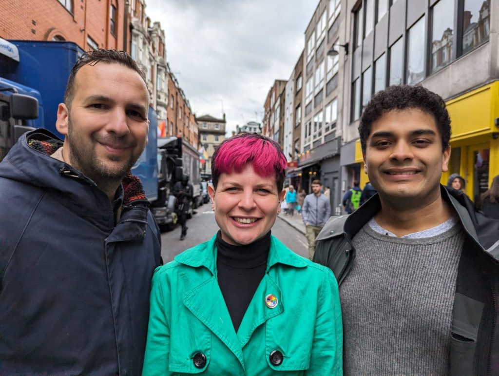 Zack Polanski, Zoë Garbett and Rajiv Sinha standing in a street in Central London.